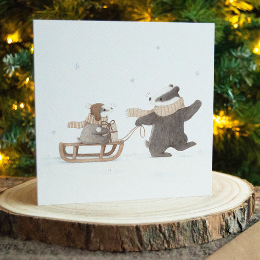 Badgers and Sled Christmas Greeting Card